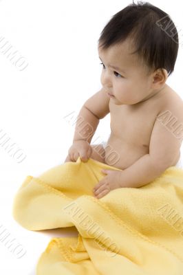 Sweet baby with a yellow blanket
