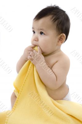 Sweet baby with a yellow blanket