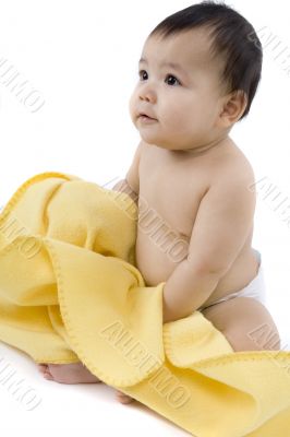 Sweet baby with a yellow blanket