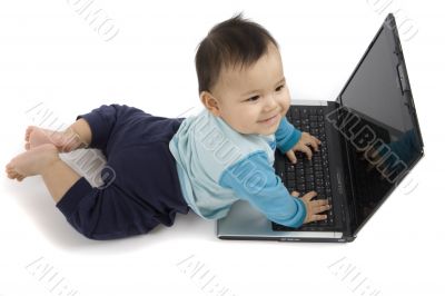 sweet baby with laptop