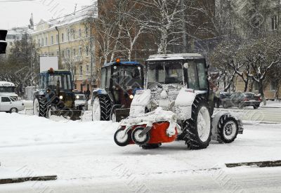 Snowplow in the city street