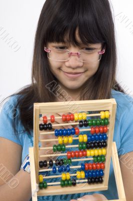 Teenager with calculator