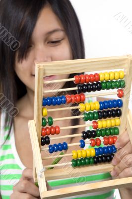 Teenager with calculator