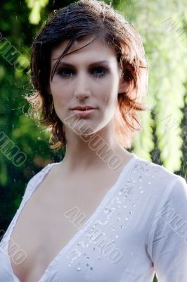 brunette in white blouse standing in the rain brunette in white blouse standing in the rain