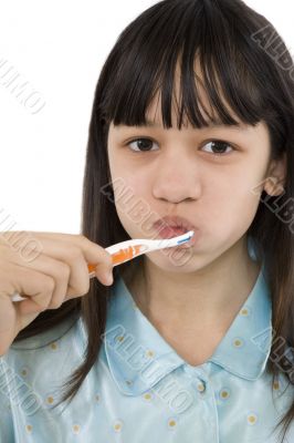 Girl cleans their teeth