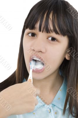 Girl cleans their teeth