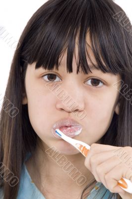 Girl cleans their teeth