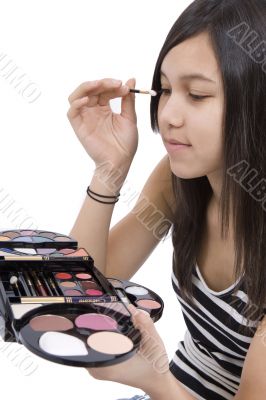 Teenager applying makeup