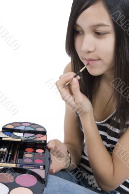 Teenager applying makeup