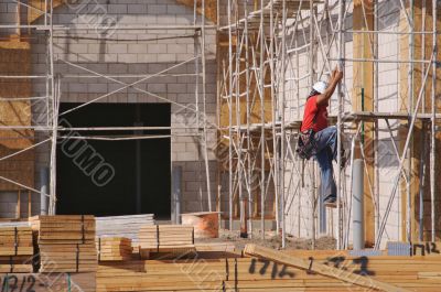 Carpenter Climbing Down Scaffolding