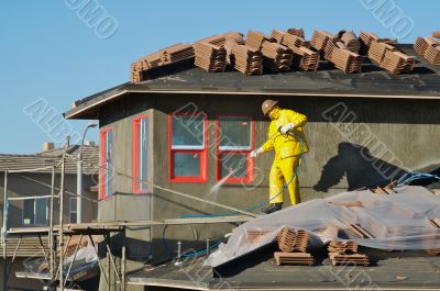 Construction Worker Pressure Washes