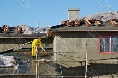 Construction Worker Pressure Washes