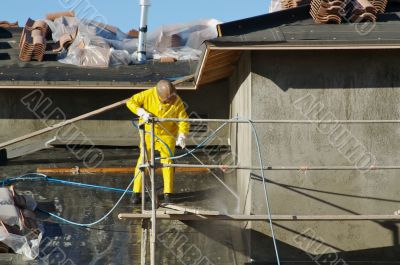 Construction Worker Pressure Washes