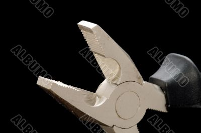 pliers on black