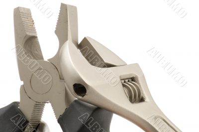 monkey wrench with pliers close up