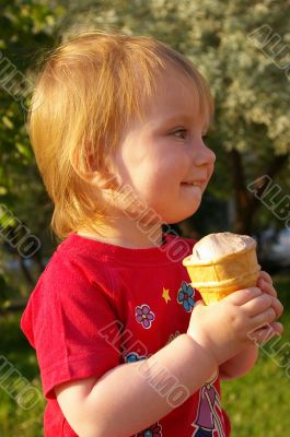 Little girl eats ice-cream