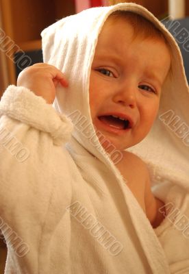 little girl cry in dressing-gown