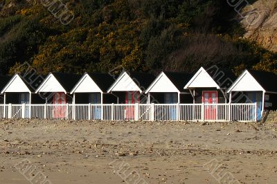 a row of beach huts a row of beach huts