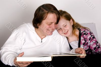 grandparent is reading to grandchild