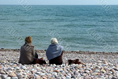 Ladies on a pebble beach 1