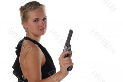 young blond woman in black dress with revolver isolated on white background