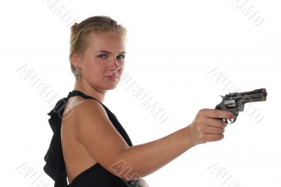 young blond woman in black dress with revolver isolated on white background