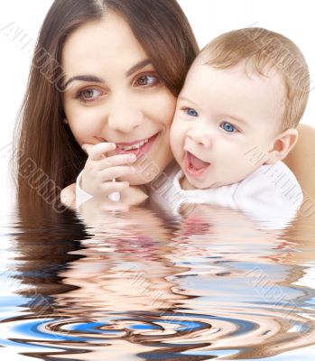 bathing baby in mother hands