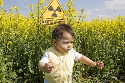 rape field with sign radio-active
