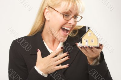 Excited Female Holding House
