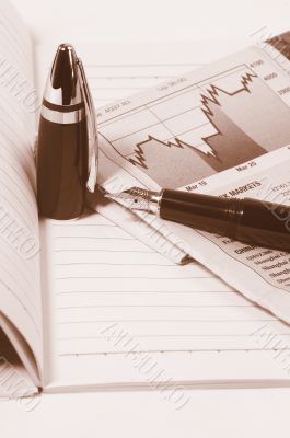 notebook  newspaper and pen