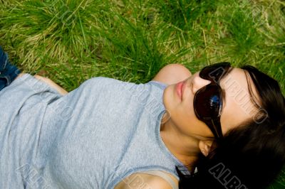 young girl on green grass