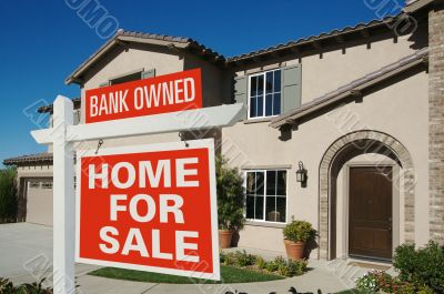 Bank Owned Home For Sale Sign in Front of New House