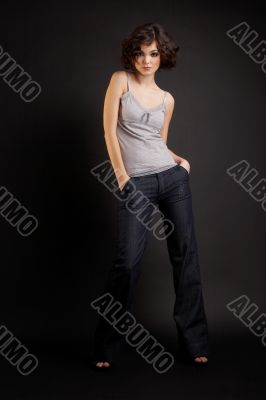 brunette girl posing on dark background