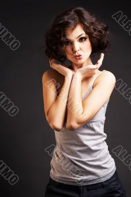 brunette girl posing on dark background
