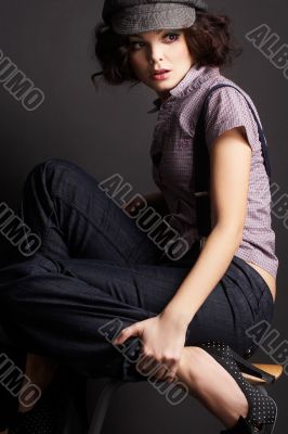 brunette girl posing on dark background