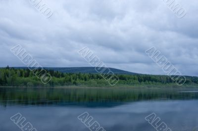 Night summer landscape. Clouds above the river. Night summer landscape. Clouds above the river.