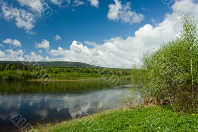 Summer landscape. Clouds above the river. Summer landscape. Clouds above the river.