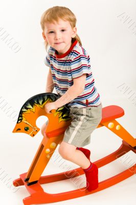 Boy on toy horse