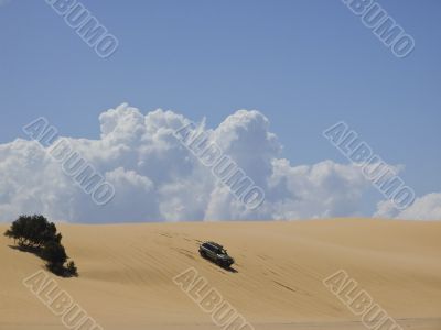 Car in the sand dune