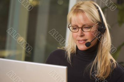 Attractive Businesswoman with Phone Headset