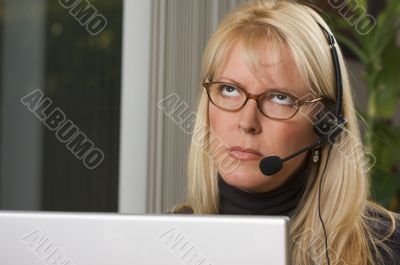 Attractive Businesswoman with Phone Headset