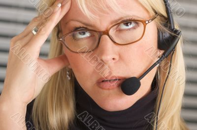 Businesswoman with Phone Headset and Headache