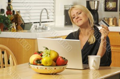 Woman Using Laptop for E-commerce