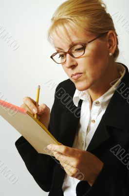 Beautiful Woman Thinks with Pencil &amp; Notepad Taking Notes