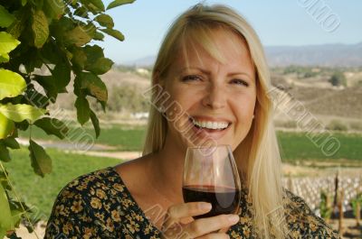 Attractive Woman Sips Wine