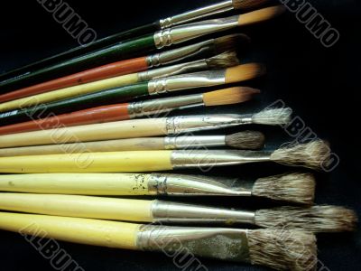 Artistic brushes on a dark background