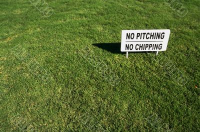 No Pitching or Chipping Sign on Lush Green Grass