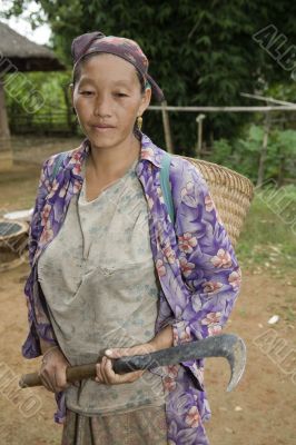 Hmong woman with sickle, Laos