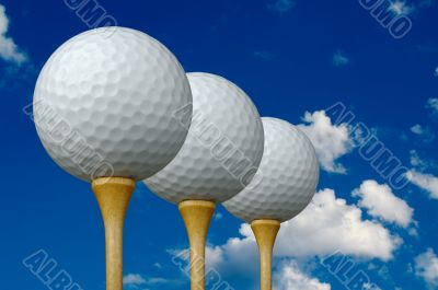Three Golf Balls &amp; Tees