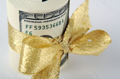 One Hundred Dollar Bills Wrapped in Gold Ribbon.